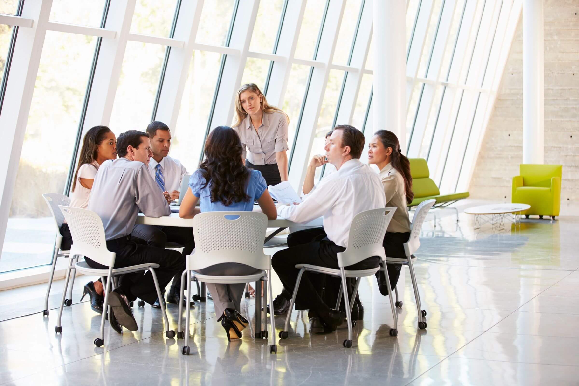 Business meeting in modern conference room.